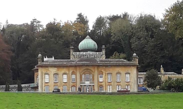 A large building with a green lawn

Description automatically generated with low confidence