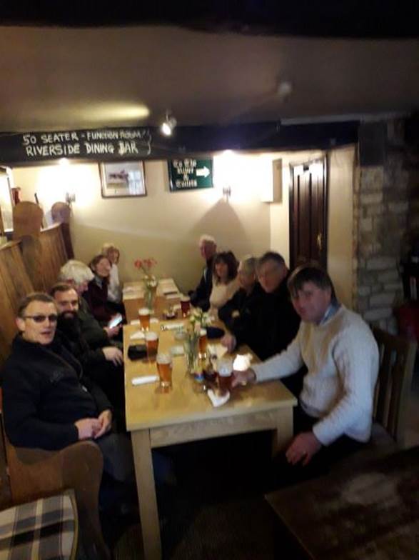 A group of people in a room

Description automatically generated with low confidence