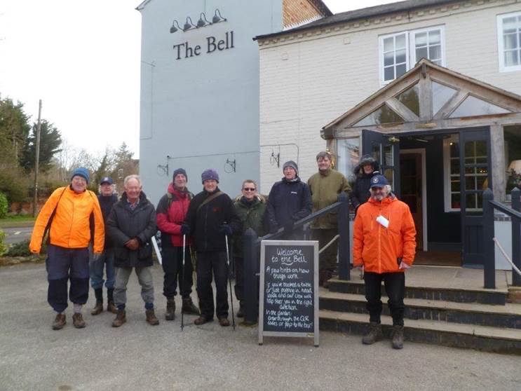 A group of people standing outside a building

Description automatically generated with medium confidence